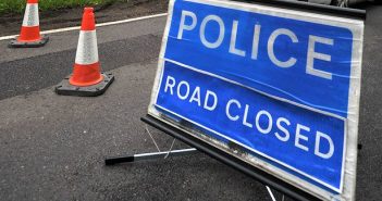 image of police road closed sign
