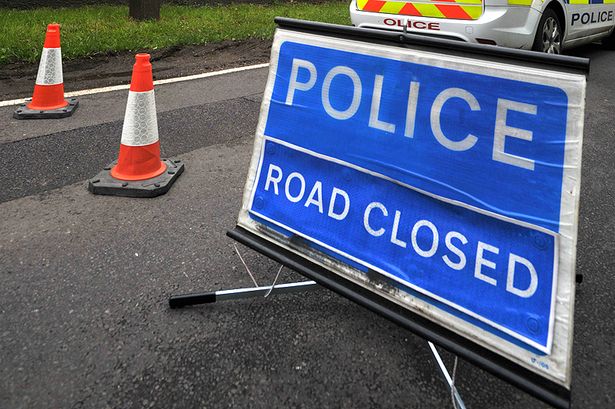image of police road closed sign