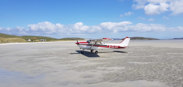 image of a private plane on a beach