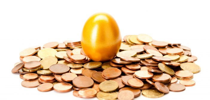 image of an easter egg on top of a pile of coins