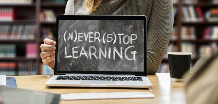 image of a laptop in a library that says 'never stop learning'