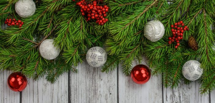 image of christmas decorations over a wooden fence