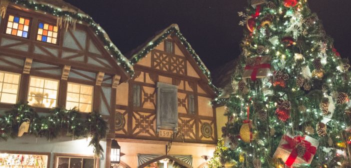 image of a traditional christmas village with a christmas tree and victorian style houses