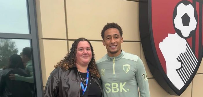 Rebekah Watts from BH1 Project and footballer Mark Tavener who presented the cheque.