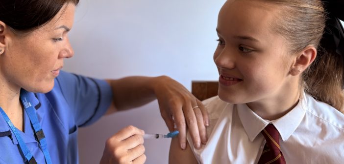 Dorset HealthCares Inurse vaccinating a child