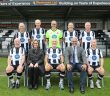 David Mears, captain of Wimborne Town’s over 60s walking football team flanked (right) by Nick Douch and (left) by Emma Reagan, from the sponsors