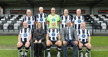 David Mears, captain of Wimborne Town’s over 60s walking football team flanked (right) by Nick Douch and (left) by Emma Reagan, from the sponsors