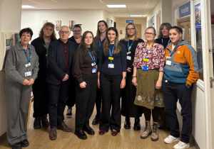 group shot of Dorset HealthCare CAMHS colleagues, a peer specialist and local MP. L-R: Helen Duncan-Jordan – head of CAMHS, William Gallini-Poole – peer specialist, Neil Duncan-Jordan – Poole MP, Nikita Adams – CAMHS and mental health support teams in schools (MHST) participation development lead, Hannah Newbound – CAMHS family practitioner, Jane Steggall – CAMHS neurodevelopmental practitioner, Tatiana Mendes-Marques – CAMHS family practitioner, Martyna Rokosz – CAMHS neurodevelopmental practitioner, Julie Atkin – CAMHS clinical service manager, Michele Whitaker – CAMHS admin lead, Coran Godfrey – student mental health nurse. Photo credit: Neil Duncan-Jordan MP